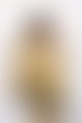 A woman wearing a silk shibori scarf, basic styling, around her neck