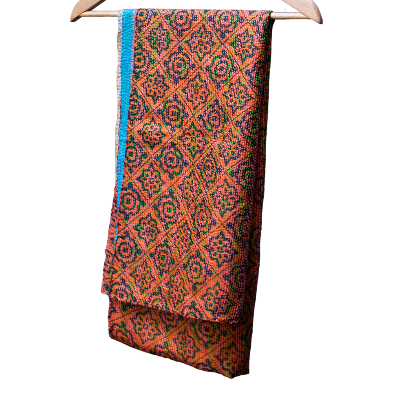 Silk shawls made from two pieces of upcycled sari fabric with tiny running stitches known as kantha