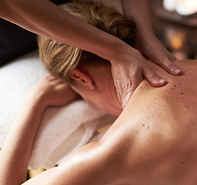 Massaging a womans neck and back