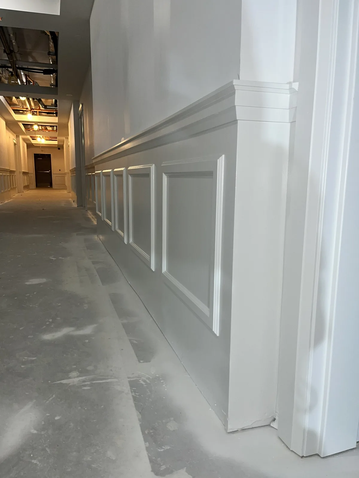 Panel moulding and chair rail ending neatly at a doorway casing