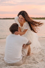 Couple looking at each other romantically on beach in st. augustine florida during photoshoot