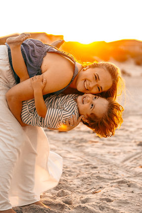 Family beach sunset photoshoot in St. Augustine Florida mom and son