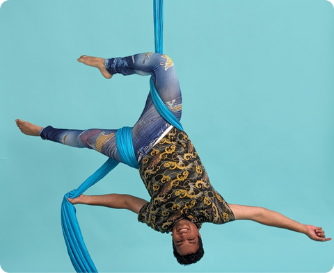 Person on aerial apparatus at Rebel Circus.