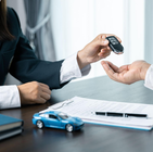 Driver reviewing car loan documents explaining vehicle lien and ownership
