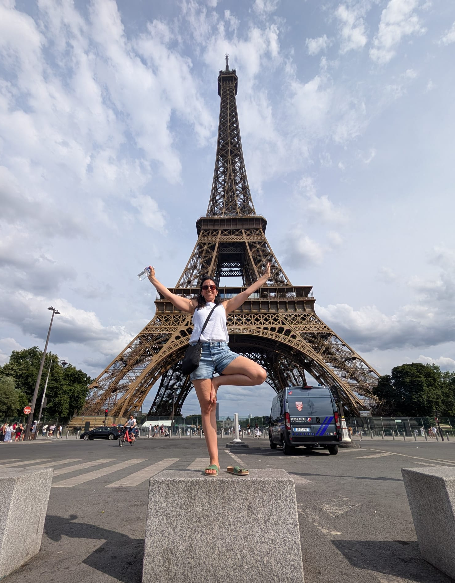 The image shows a person performing an energizing morning yoga stretch in the sunshine.