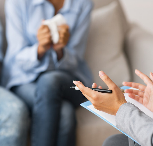 Therapist counseling couple, addressing concerns