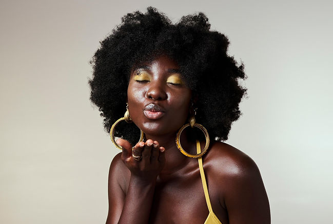 Black woman blowing a kiss