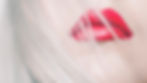 Close up of red lips of a blonde woman and face