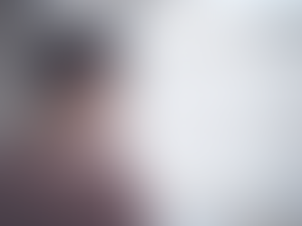 Man looking out of window feeling guilty