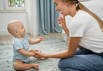side-view-mom-spraying-hand-sanitizer-child-s-hands.jpg