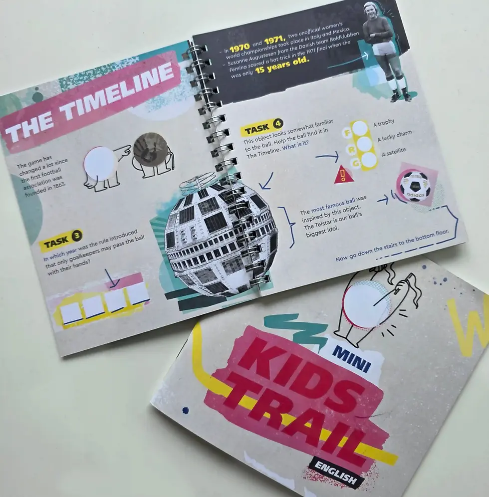 Open FIFA Museum kids trail booklet on football history, with timeline, tasks, arrows, and bright pink Kids Trail cover on a white table.