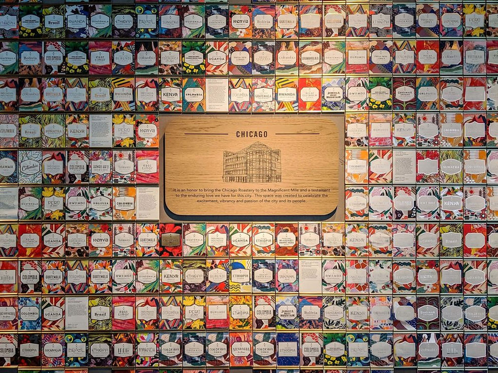 A colorful wall features a wooden plaque labeled "Chicago," surrounded by decorative tea labels with floral patterns and various texts.