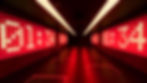 Dark room with bright red digital numbers "01:34" on walls at the Silverstone Museum. Red strip lights on ceiling and floor, creating a futuristic atmosphere.