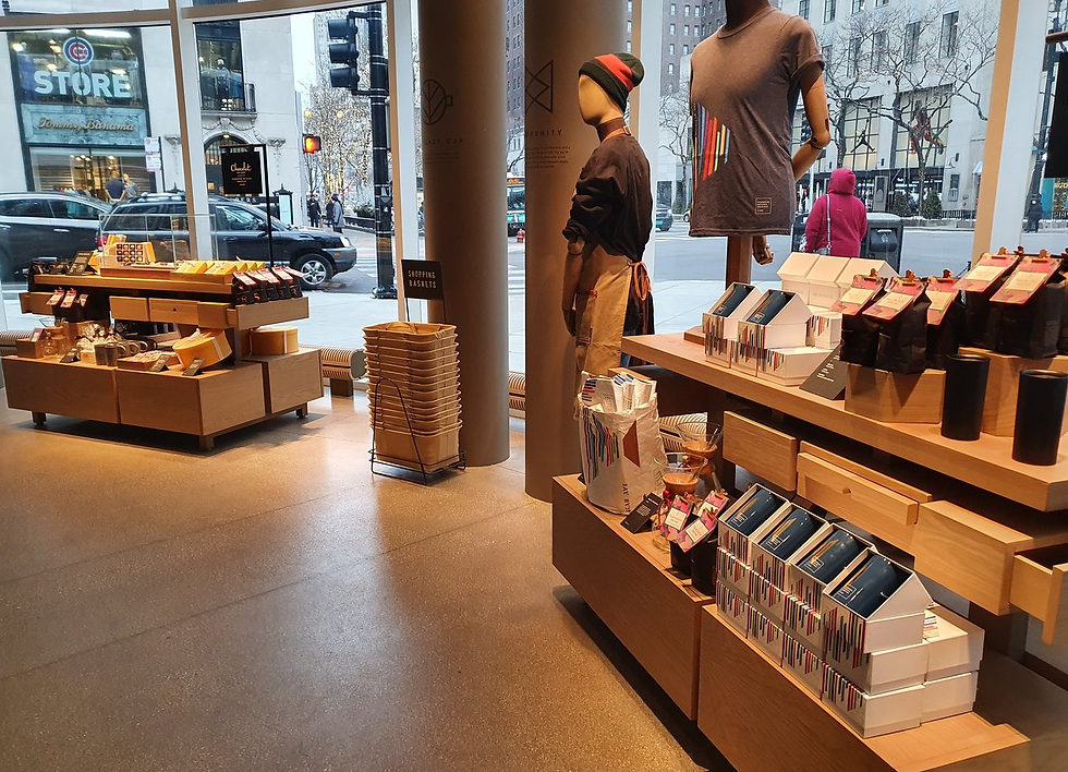 Store interior with wooden shelves displaying products, mannequins, and "Shopping Baskets" sign. Large windows show a busy street.