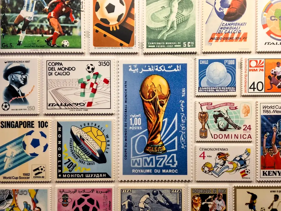 Collage of vintage World Cup soccer stamps at the FIFA museum, from various countries, showing balls, players, trophies, and multilingual text.
