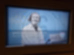 Image of Margaret Mabel Gladys Jennings on an audio visual display screen at Silverstone Museum, with text detailing her as a Scottish motor racing driver. Blue background and a British flag emblem.