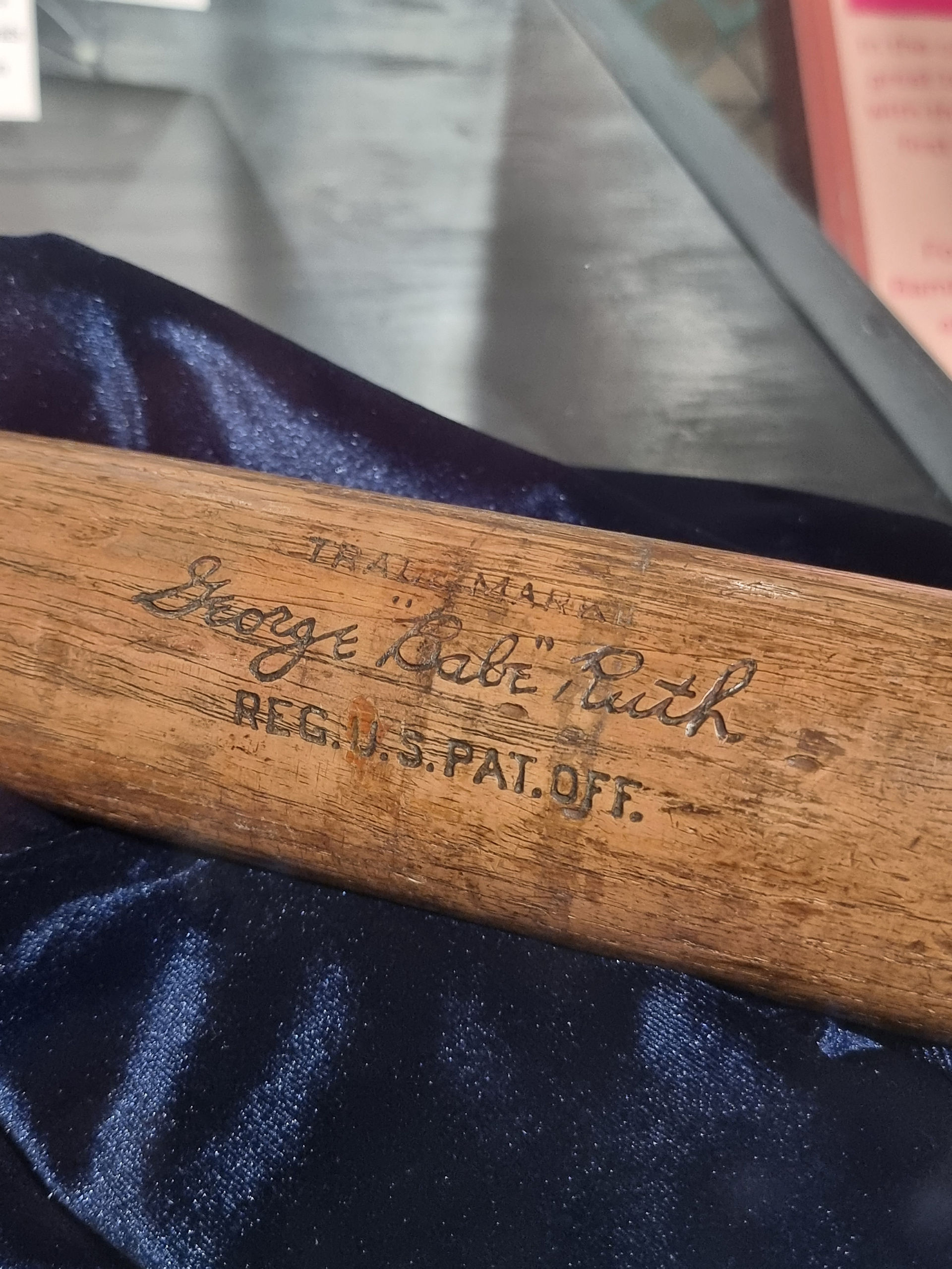 close up of a baseball bat with the signature of babe ruth etched into it