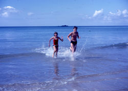 Children Running Through the Surf