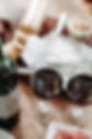 wine bottle next to 2 glasses of wine