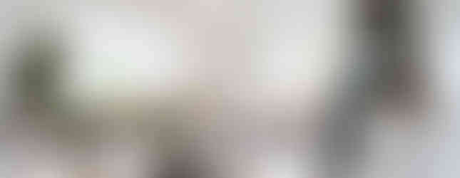 Inviting modern living room with warm, cozy decor, comfortable furnishings, and ambient lighting.