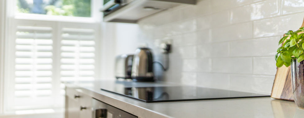 Sleek and modern fully equipped kitchen boasting contemporary design, high-end appliances, and efficient functionality for culinary excellence.