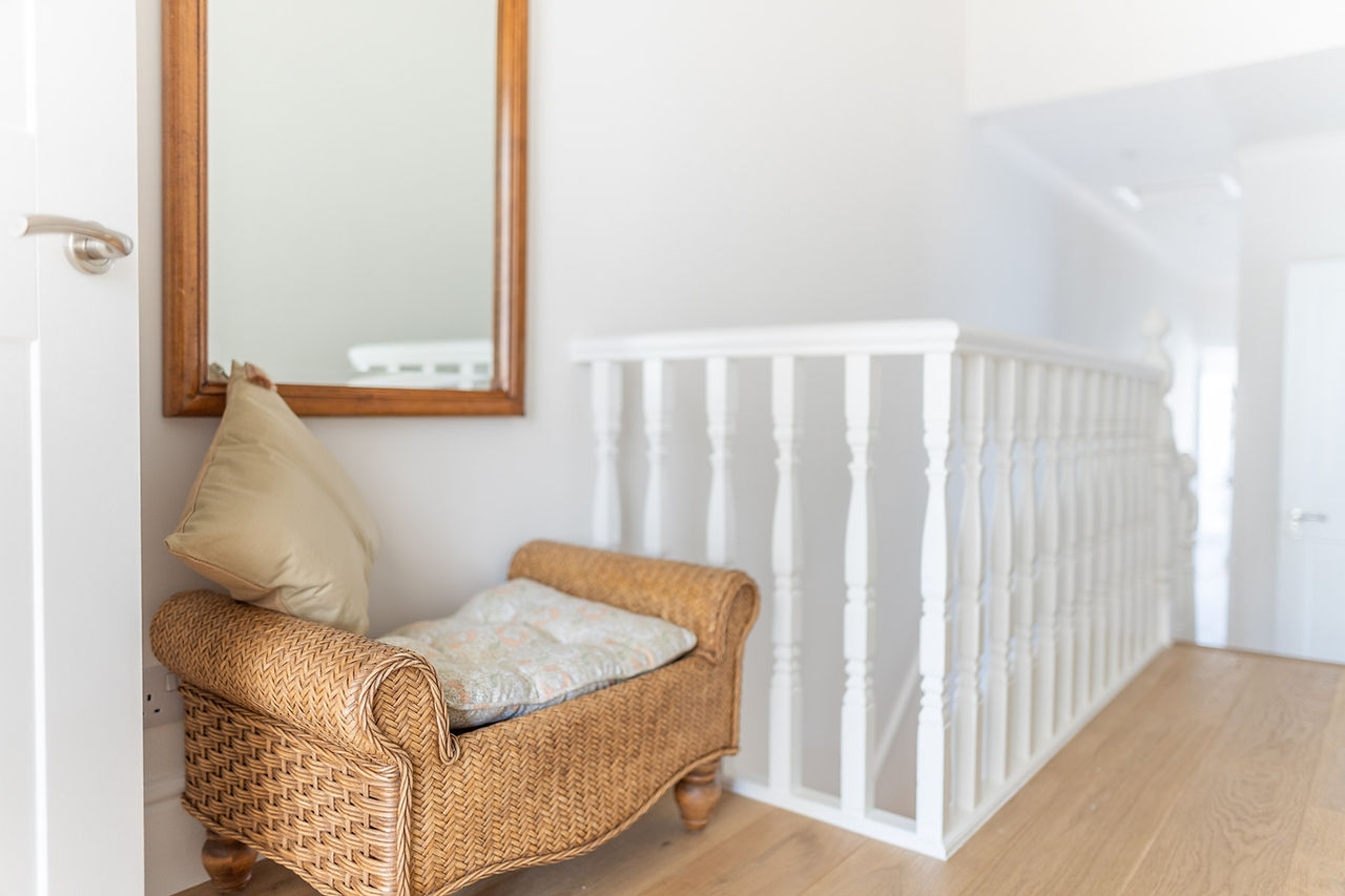 Hallway with a shoe bench connecting rooms at The Pontcanna Pearl, Cardiff, providing convenient access.