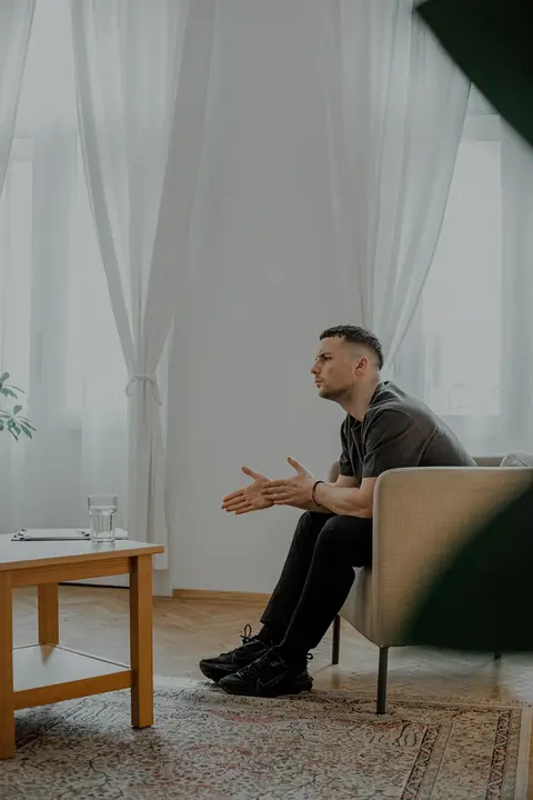 A male psychotherapist in his office
