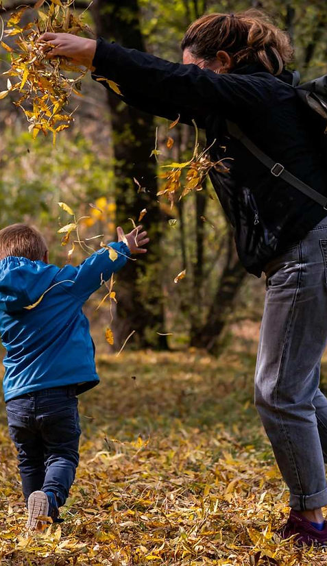 Parent and child enjoying outdoor time in a safe and family-friendly townhome community environment.