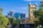 View towards the Tower Bridge and the skyscrapers in downtown Sacramento on a sunny day; C