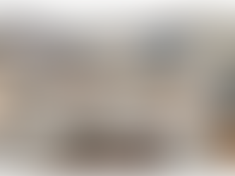 Spacious walk-in pantry with white cabinetry, open shelves displaying kitchen essentials, and a window for natural light, featured under the title "The Art of the Walk-In Pantry (& Why It’s a Game Changer)" with the Heartstone Custom Homes logo.