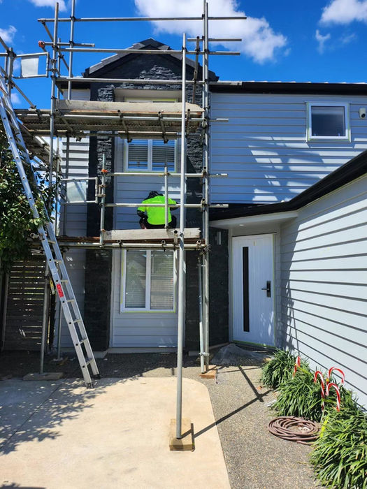 Erect scaffolding and decorate exterior walls
