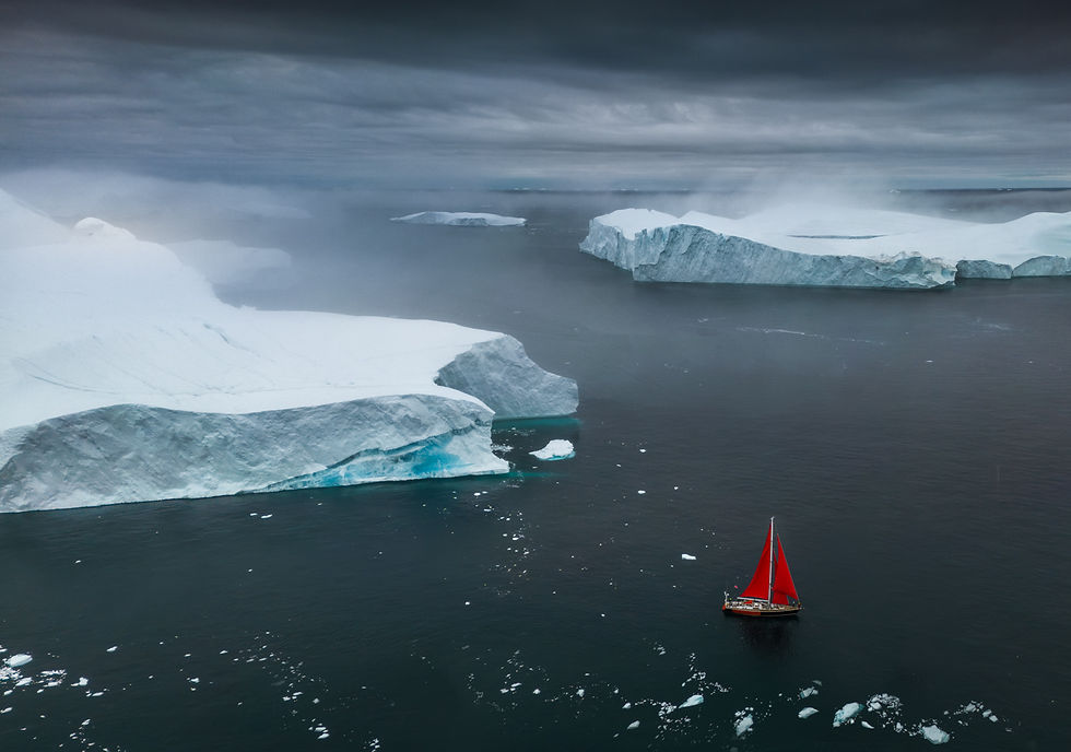 ice fjord and red sails in disko bay greenland
