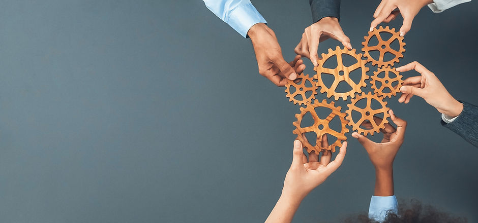 Panoramic shot top view of business people holding cog wheel as unity and teamwork in corp