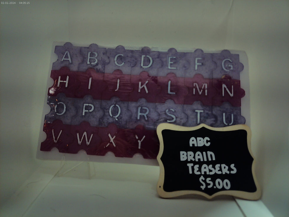 Colorful resin ABC brain teaser puzzle arranged in alphabetical order.