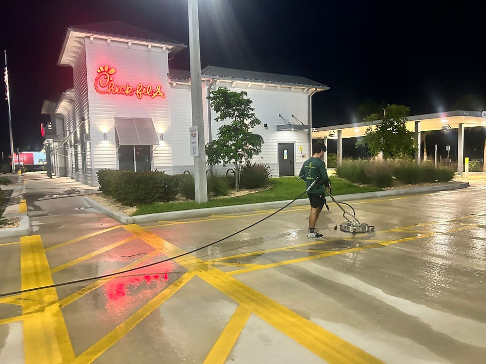 Michael pressure washing in front of Chick-fil-A. (Photo Credit: Michael Babun)