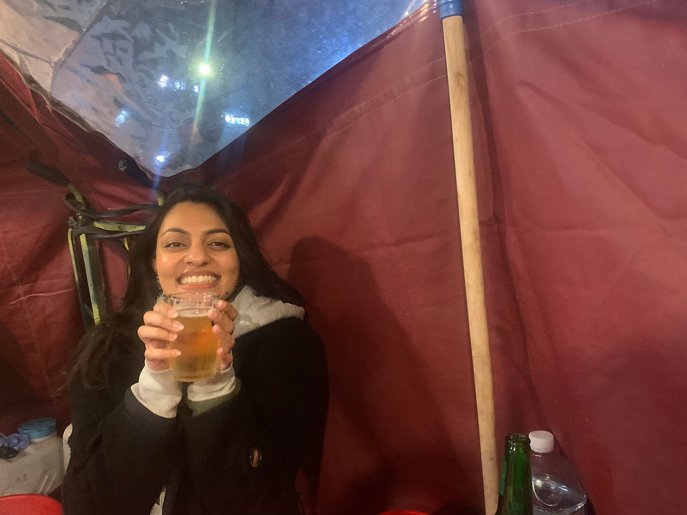 Me at the red tent! Photo source: Gabriella