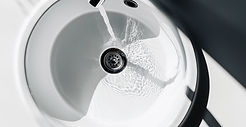 basin tap running smoothly into bowl after replacing the filter of the tap in West London