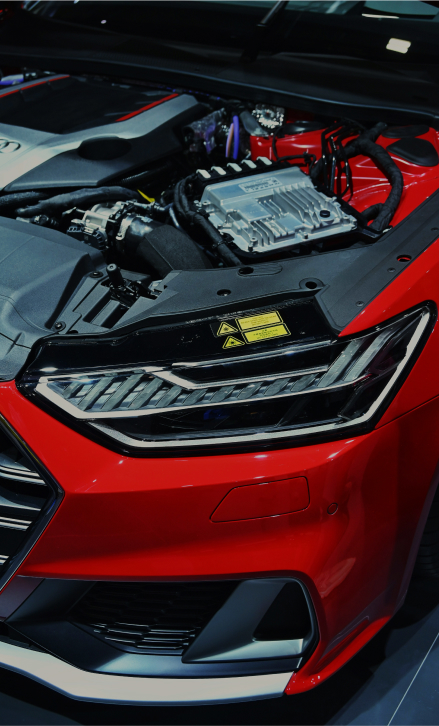 Detailed front end of a red performance car at ProLine