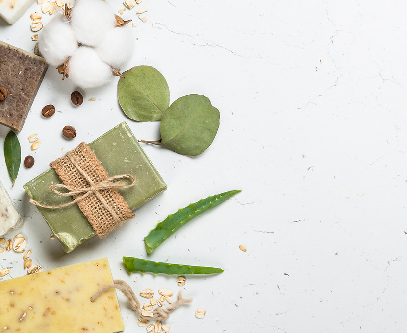 Table top with soaps, leaves & grains