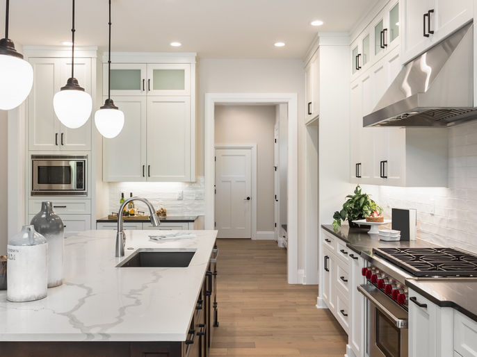 Modern kitchen design with marble countertops and stainless steel appliances