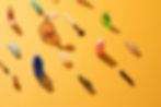 Composition of beauty products over yellow background