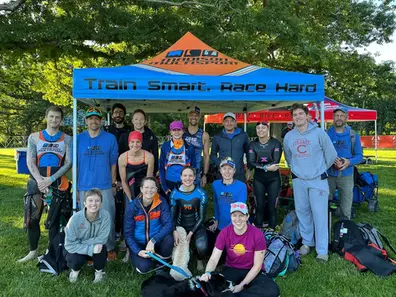 Custom 10x10 sports team tent with printed top and valance used in a park event