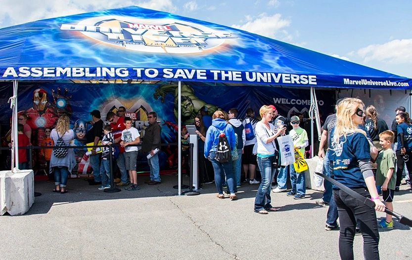 Crowd gathered at Marvel Universe Live activation under custom frame tent