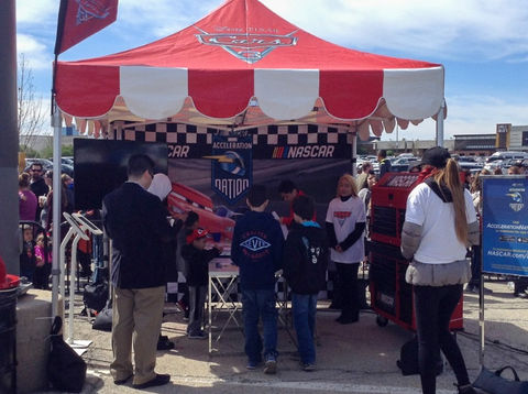 10x10 branded pop up canopy for a NASCAR promotional event with custom printed sidewalls.