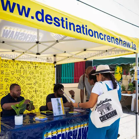 Custom 10x10 canopy tent with branded graphics for community engagement at Destination Crenshaw event