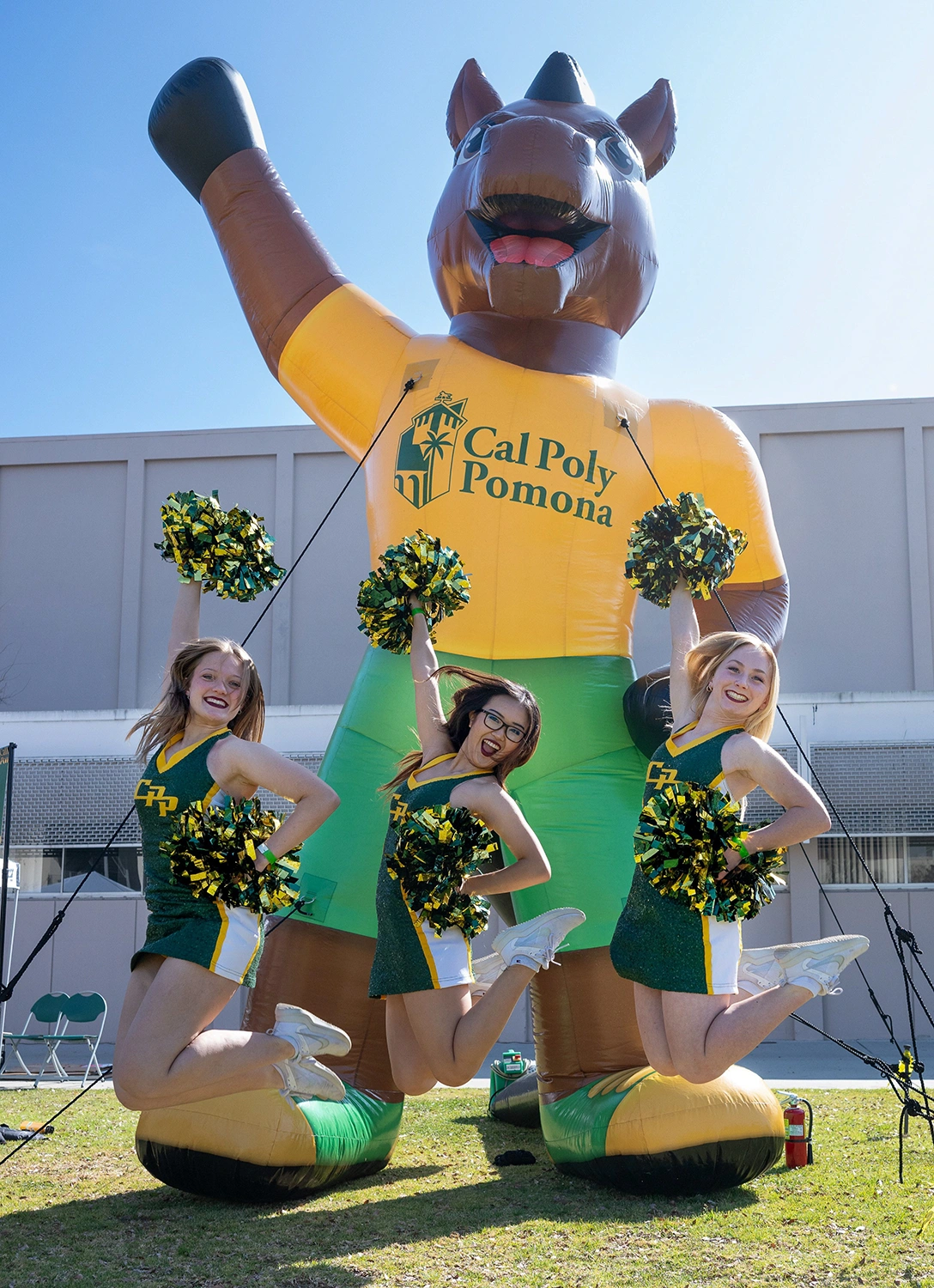 Cal Poly Pomona inflatable horse mascot with cheerleaders at school spirit event