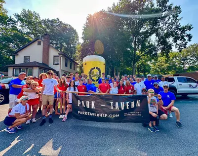 Custom giant inflatable beer glass display for Park Tavern at an outdoor community event