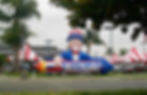 Giant Inflatable Uncle Sam Holding a Rocket 4th of July Sale at Cerritos Car Dealer