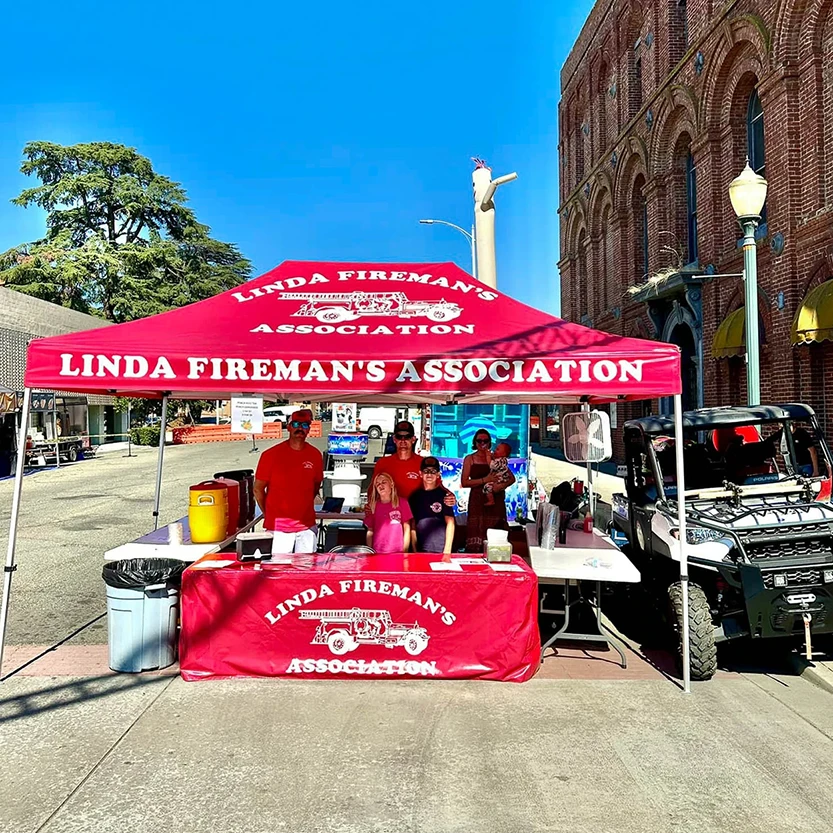 Custom 10x15 Pop Up Tent advertising a firefighter association.