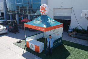 Smile California tent with inflatable topper for dental health outreach